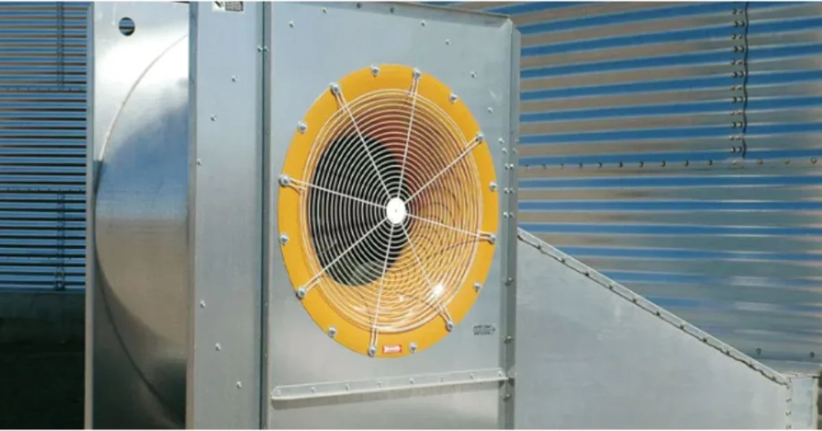 Industrial ventilation fan mounted on metal building