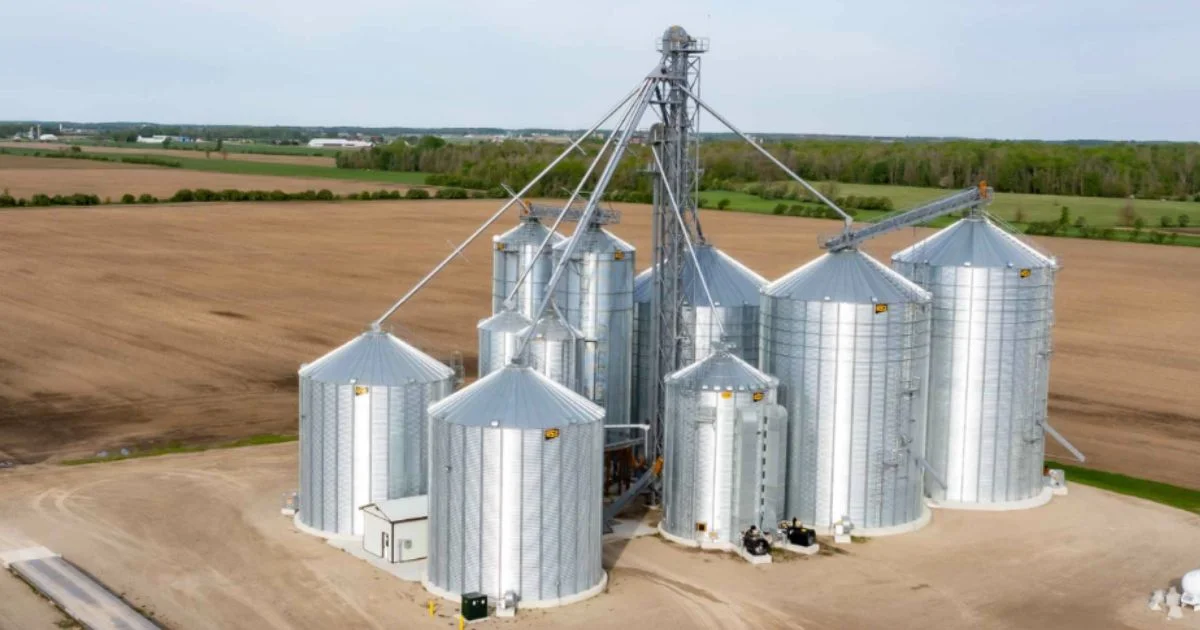 On-farm grain storage silo system with conveyors and bins