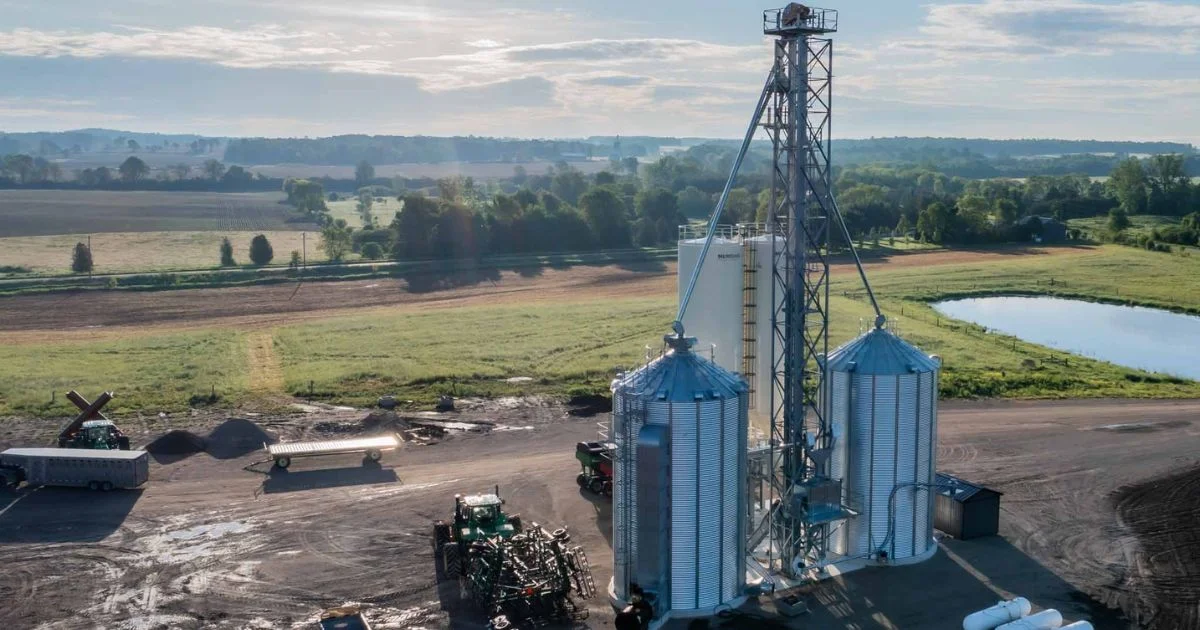 Farm grain storage bins with elevator tower